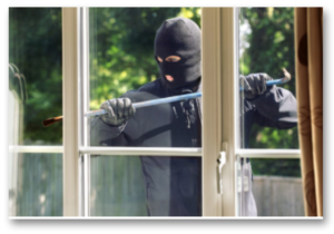 Burglar breaking in to home